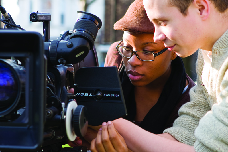 Film student lines up a shot on the viewfinder