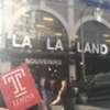 A picture of a TU Sticker in front of LA LA LAND